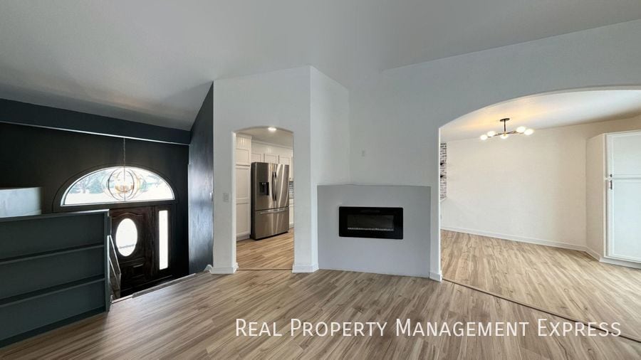 Primary Photo - Spacious 4BR, 2BA Gem with Fireplace and O...