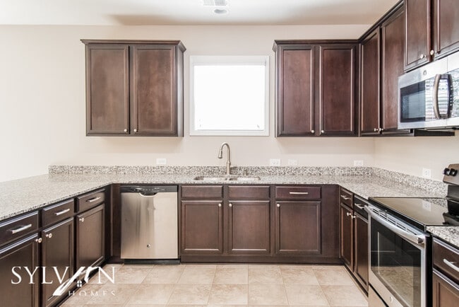 Building Photo - Embrace the charm of this 4 BR, 2.5 BA home