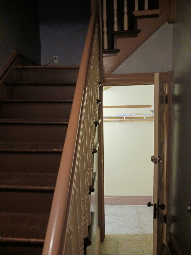 Stairs lead up. Door to basement with lots of storage - 2342 Arkansas Ave
