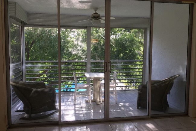 Screened in Patio with sun shades - 1900 Sabal Palm Dr