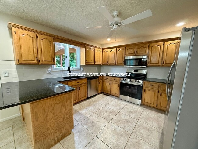 Building Photo - Spacious 3 Bedroom Home with Finished Basement, Covered Deck & Fenced Yard