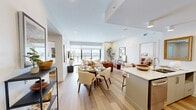This contemporary apartment, located at 2016 Linkway Blvd in London, Ontario, offers a well-designed living space of 930 square feet. The layout comprises four bedrooms, including a spacious 160 square foot primary bedroom, and two bathrooms. The open-concept design seamlessly integrates the kitchen and living areas, creating a fluid and spacious atmosphere.

The kitchen is a highlight, featuring sleek white cabinetry, stainless steel appliances, and a large island with comfortable seating. The living room boasts floor-to-ceiling windows that flood the space with natural light and provide stunning panoramic views of the surrounding area. Stylish furniture and decor elements, such as plush area rugs and modern artwork, add character throughout.

The bedrooms are thoughtfully designed with ample natural light and tasteful color schemes. The bathrooms showcase luxurious finishes, including marble-look tiling and glass-enclosed showers. Hardwood flooring runs throughout most of the apartment, enhancing its modern aesthetic.

Attention to detail is evident in the carefully curated decor, from the strategically placed indoor plants to the artful arrangement of throw pillows and accent pieces. The overall ambiance is one of contemporary elegance, offering a perfect blend of comfort and style in an urban setting.