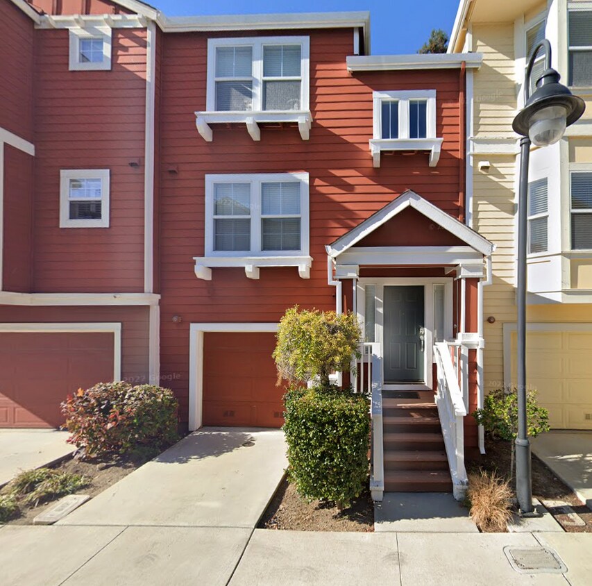 East facing entrance. Another parking space in driveway in front of garage. - 757 Seneca Ter