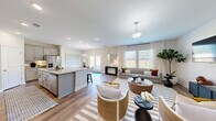 This 1780 square foot home in Navassa, NC offers a blend of comfort and functionality across two floors. The ground floor, spanning 710 square feet, includes a modern kitchen with granite countertops, stainless steel appliances, and ample cabinet space. The open-concept living and dining area features hardwood floors, large windows, and a stylish striped area rug, creating a welcoming atmosphere.

The upper floor, at 1070 square feet, houses four bedrooms, including a spacious 240 square foot primary suite. All four bathrooms are well-appointed, with one showcasing clean lines and wood-look flooring. The home also includes a dedicated office space with a wooden desk and contemporary decor, perfect for remote work or study.

Additional amenities include a laundry room with top-loading appliances and built-in storage, multiple closets for organization, and a garage for secure parking and storage. The property boasts a fenced backyard, offering outdoor space for relaxation or entertainment.

Throughout the home, neutral tones and modern fixtures create a cohesive, contemporary aesthetic. The hardwood floors, white walls, and strategic lighting contribute to a bright and airy feel in every room. This thoughtfully designed residence combines style and practicality, making it an ideal family home or investment property.