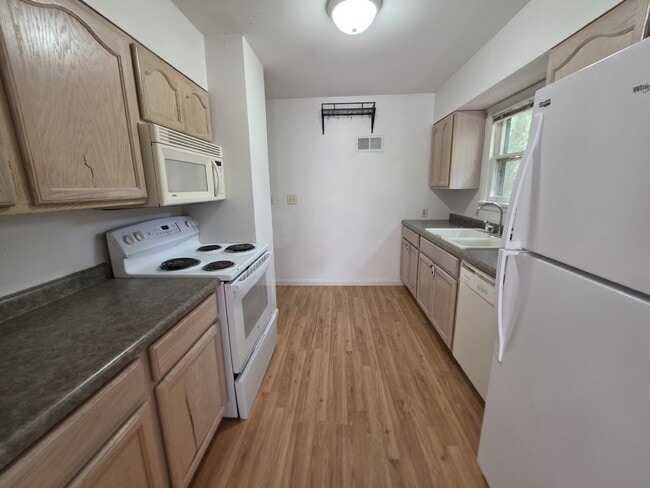 Building Photo - 2 Bedroom, 1 Bathroom West Hill Home with Fenced Yard, Garage, & Bonus Living Space