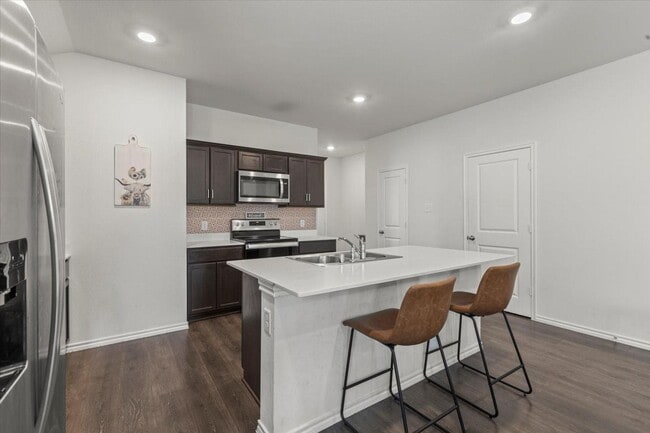 Building Photo - Modern single-story home with 4 bedrooms, 2 bathrooms, open-concept living, stylish kitchen, two-...