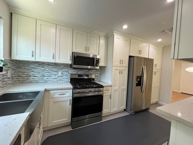 Building Photo - AVAILABLE NOW! Upgraded Encino 4+2.5 w/all...
