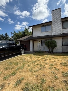 Front with driveway parking and attached garage - 701 F Pl NE
