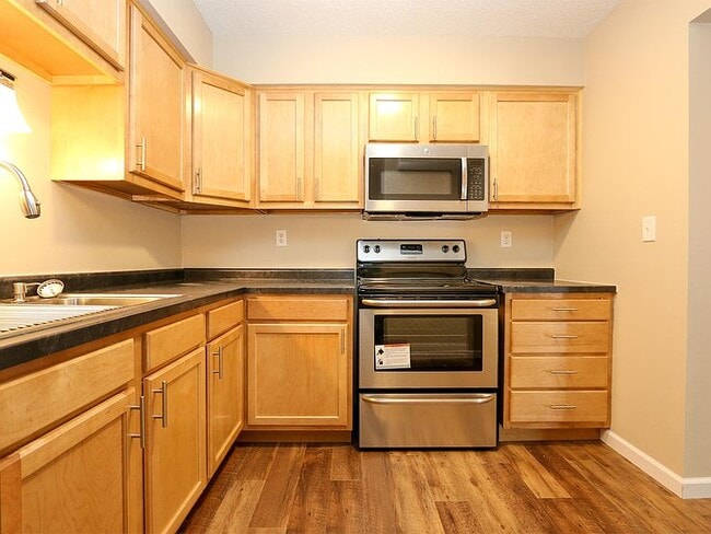 Kitchen with stainless steel appliances - 16045 Joplin Ave