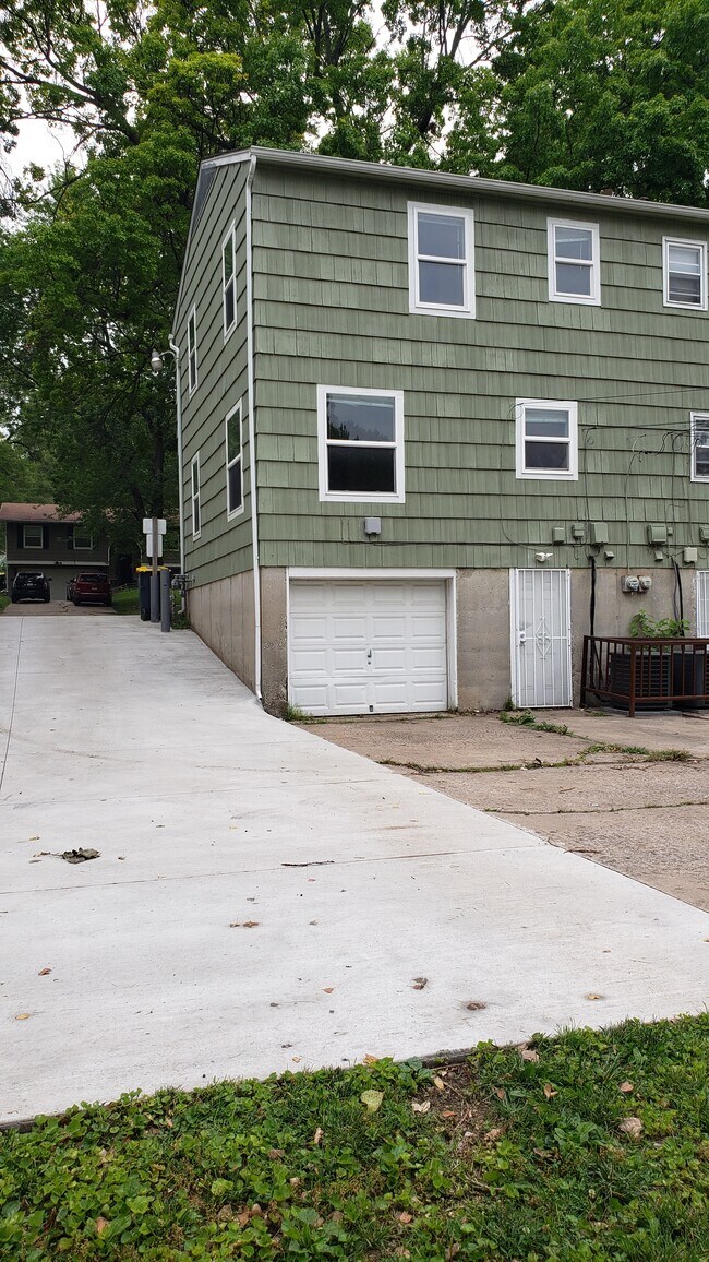 Rear of duplex with 1 car basement garage, storage and private laundry hookups - 6621 Walrond Ave