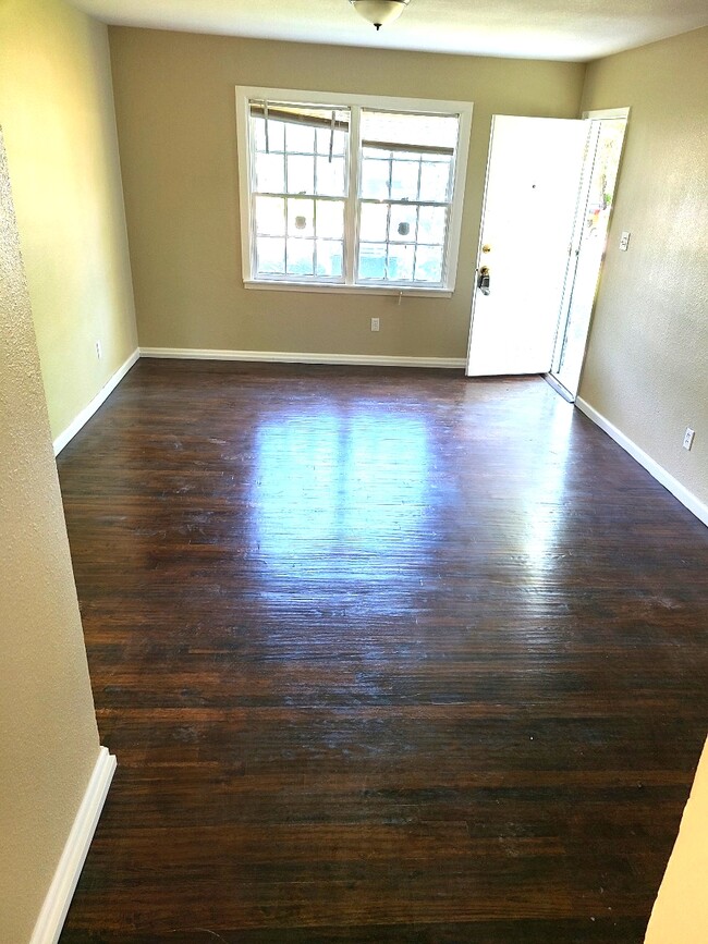 Refinished hardwood floors in main living room - 4244 Asbury Ave