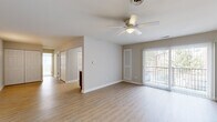 Located at 101 Steuben Dr. in Guilderland, NY, this two-bedroom, one-bathroom single-floor home offers a comfortable and well-organized layout. The living room is a bright, open space featuring light wood-style flooring, a ceiling fan with integrated lighting, and a sliding glass door that opens to a private balcony with outdoor views — allowing natural light to pour in. A built-in louvered storage cabinet adds a practical touch to the living area.

The kitchen is well-appointed with a two-tone cabinetry design — white upper cabinets contrasted by rich dark lower cabinets — complemented by light stone countertops and stainless steel appliances, including a refrigerator, dishwasher, and range. A window above the sink brings in natural light, enhancing the functional workspace.

Both bedrooms are carpeted and feature ceiling fans, neutral walls, and windows that allow ample daylight. The generously sized primary bedroom benefits from two windows, providing views of the surrounding area. The second bedroom is equally comfortable with its own window and ceiling fan.

The bathroom is clean and functional, featuring a full tub-shower combo, marble-style tile flooring, white cabinetry, and brushed nickel fixtures. A hallway and dedicated closet complete this efficiently designed home.