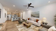 Located at 4101 Fiske Trail in Rockledge, Florida, this well-appointed single-story home offers 2 bedrooms and 2 bathrooms within a thoughtfully designed open-concept floor plan. The combined living, dining, and kitchen area forms the heart of the home, bathed in natural light from large windows and complemented by wood-look flooring and recessed lighting throughout. A ceiling fan adds both style and function to the living space.

The modern kitchen is a standout feature, showcasing light wood cabinetry, a white subway tile backsplash, quartz countertops, stainless steel appliances, and a spacious island with bar seating — ideal for casual dining and entertaining. A dedicated pantry and an in-unit laundry area add practical convenience.

The primary bedroom is generously sized with its own walk-in closet offering extensive shelving and hanging space. The en-suite bathroom features a wide quartz vanity with light wood cabinetry, a glass-enclosed walk-in shower with built-in shelving, and wood-look tile flooring. The second bedroom is bright and comfortable, served by a well-appointed full bathroom with a quartz vanity and tub-shower combo. Additional closet storage is distributed throughout the home, ensuring ample organization for everyday living.