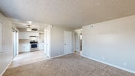 Located at 315 W Alamos Ave in Clovis, CA, this 2-bedroom, 1-bathroom single-floor unit offers a well-organized and functional layout. The open-concept living and dining area features plush wall-to-wall carpeting and a textured ceiling, creating a cozy yet clean aesthetic. A ceiling fan keeps the space comfortable year-round. The kitchen is outfitted with crisp white shaker cabinets, light stone-look countertops, stainless steel appliances including an electric range, dishwasher, and refrigerator, and durable light wood-look vinyl flooring. A pantry provides added storage convenience. Both bedrooms are carpeted and feature textured ceilings and ceiling fans, with the primary bedroom offering a generous footprint. Multiple closets throughout the unit ensure ample storage. The full bathroom includes a tub/shower combo, a vanity with a light stone countertop, and wood-look vinyl flooring. A hallway connects the main living spaces, and two utility rooms add practicality. A private balcony extends the living space outdoors. The unit's neutral color palette and clean finishes provide a move-in-ready feel throughout.