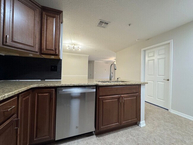Building Photo - Oviedo 2/2 Condo with Tile & LVP Flooring, Updated Baths, New Paint & Appliances!