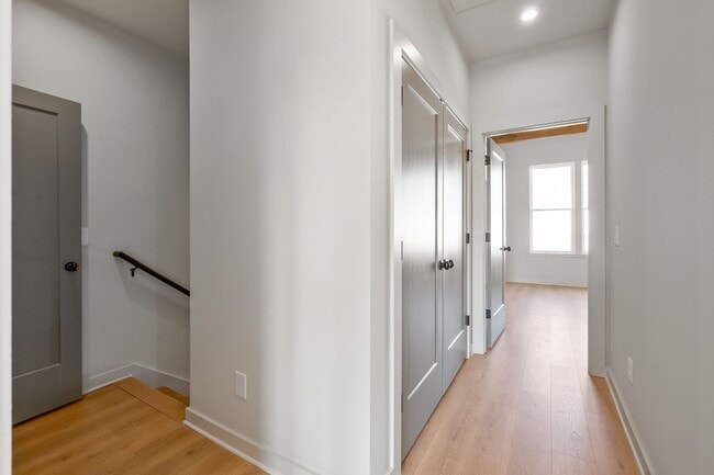 Building Photo - Captivating end unit townhome with covered...