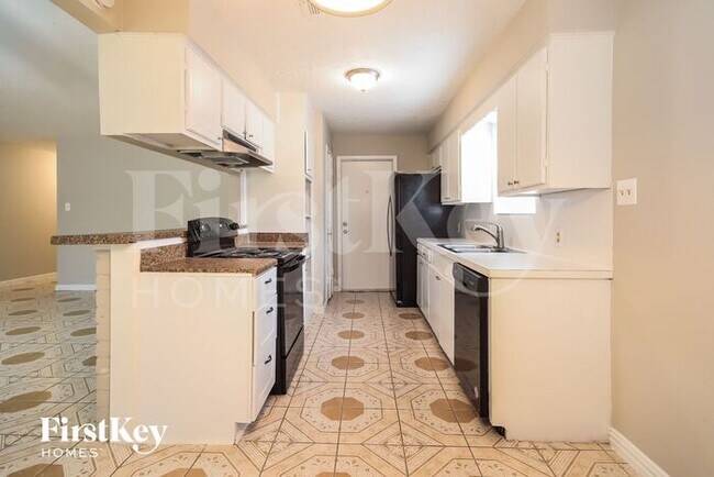 Foto del edificio - 5614 Rivergate Dr