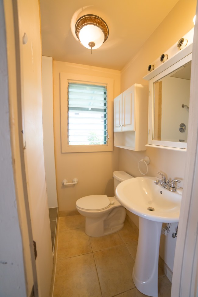 Nicely renovated bathroom with ceramic tiled floor & standing shower - 1804 Poki St