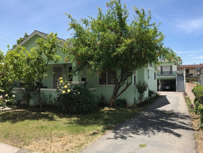 Main House 3bed/2bath with driveway leading to detached 3 units - 1304 E Wilson Ave