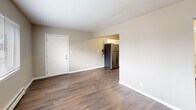 This 530 square foot single-story home in Lincoln Park, Michigan, offers a practical layout with two bedrooms and one bathroom. The living room greets visitors with warm wood-look flooring and ample natural light from a large window. The modern kitchen boasts white cabinetry, stainless steel appliances, and a subway tile backsplash, creating a bright and functional cooking space.

Both bedrooms feature plush carpeting and sizable windows, with the primary bedroom measuring 120 square feet. The bathroom is equipped with a standard tub-shower combination and neutral tiling. Throughout the home, neutral-toned walls and simple light fixtures contribute to a clean, contemporary aesthetic.

The property's efficient design includes a hallway connecting the rooms and closet space in the bedrooms. Baseboard heating units ensure comfort throughout the seasons. While compact, this home maximizes its 530 square feet to provide a cozy and functional living space, ideal for singles, couples, or small families seeking a low-maintenance dwelling in a suburban setting.