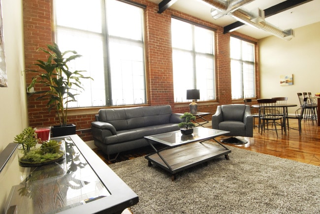 Exposed brick and beam styling - American Wire Residential Lofts