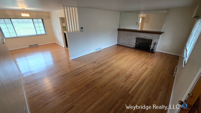 Building Photo - Charming Mid-Century 2BR Home with Sunroom, Fireplace & Fenced Yard