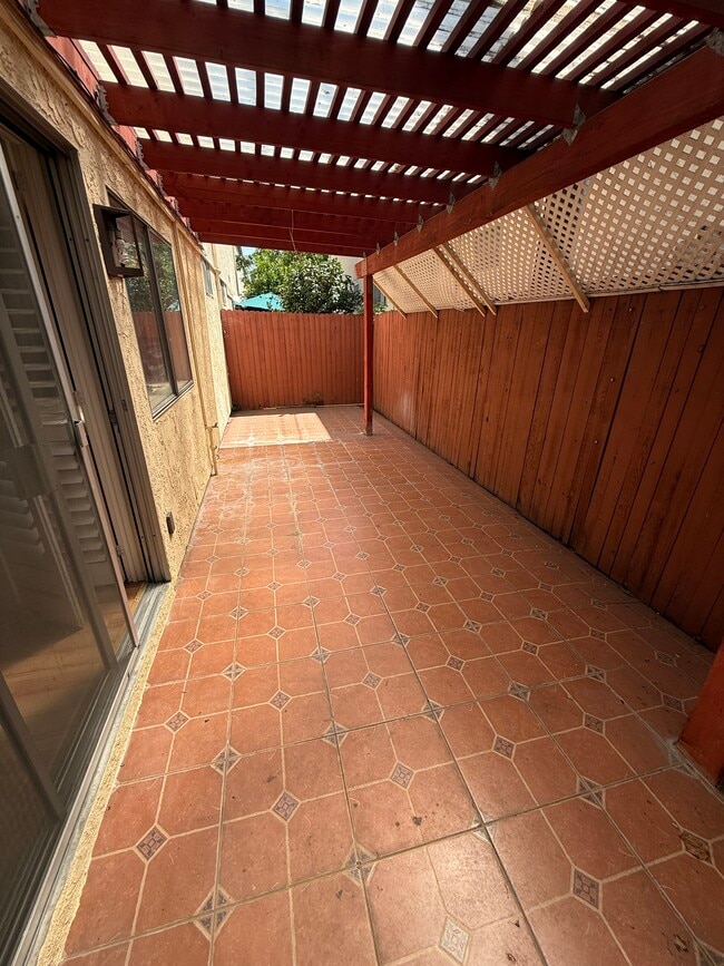 Enjoy a private covered patio, perfect for outdoor dining or relaxing in the shade - 1134 W Huntington Dr