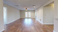 Located at 500 Avalon Way in Brandon, Mississippi, this single-story, 2-bedroom, 1-bathroom home offers a well-designed layout with a comfortable and functional living environment. The open living room is a standout feature, showcasing warm hardwood-style flooring, recessed lighting, a ceiling fan, and a set of French doors that invite natural light and provide outdoor access. A chandelier adds a refined touch to the adjacent dining area, which connects seamlessly to the kitchen via a pass-through window. The kitchen is well-appointed with dark wood cabinetry, stone-look countertops, a tile backsplash, and stainless steel appliances including a dishwasher and over-the-range microwave. The primary bedroom is generously sized, featuring plush carpeting, a ceiling fan with light, and multiple windows that brighten the space. It is complemented by a walk-in closet with wire shelving for ample storage. The second bedroom also features carpet and easy access to the main living areas. The shared bathroom is tastefully finished with a granite-topped vanity, wood-tone cabinetry, a large mirror, and a full soaking tub with shower. A textured ceiling and neutral wall tones throughout lend a cohesive, welcoming ambiance to this well-maintained home.