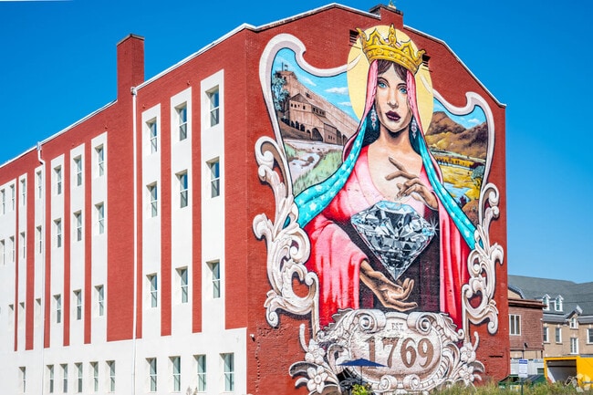 The Lady of the Valley mural in Wilkes-Barre is made by a Philadelphia artist named Evan Lovett.