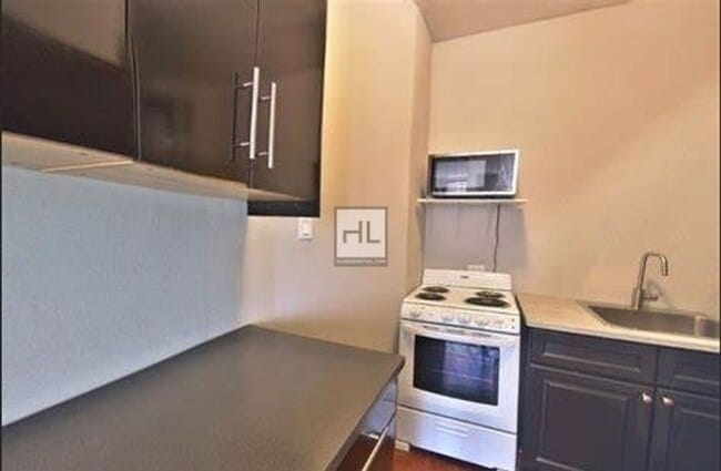 Building Photo - AFFORDABLE, SPACIOUS + SUNNY STUDIO IN THE...