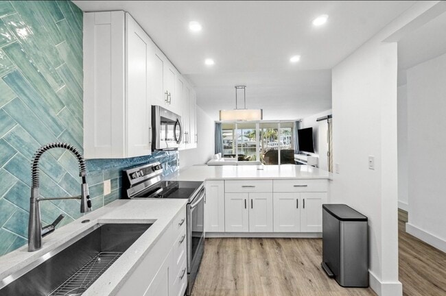 Photo - 698 NE Spanish River Blvd Apartment