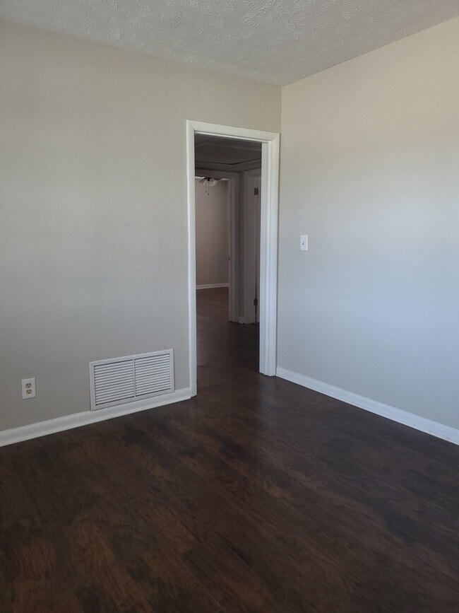 Hallway to the 3 bedrooms, 2 bathrooms - 6546 Merrill Rd