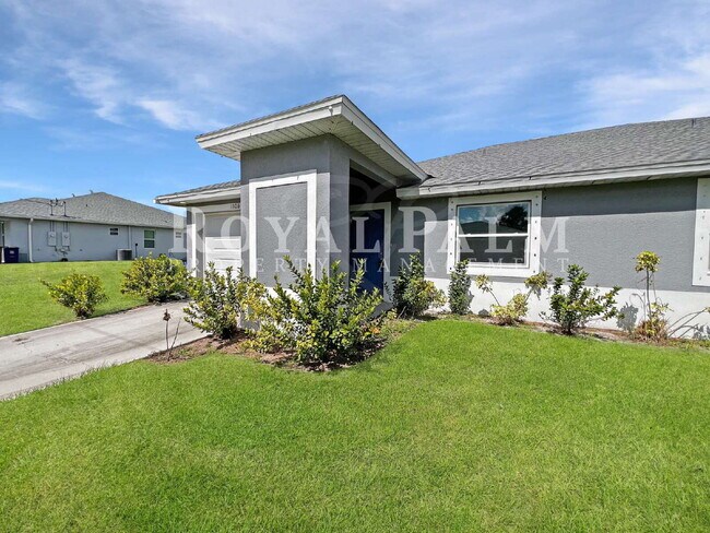 Building Photo - Move-In Special! Half Month FREE – APPLY by December 15th – Modern 3BR/2BA Duplex in Lehigh Acres...