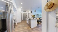 Located at Homestead in Fort Collins, Colorado, this single-story residence offers a thoughtfully designed open-concept layout with one bedroom, two full bathrooms, and a dedicated closet. Wood-look flooring flows throughout the main living areas, creating a warm and cohesive aesthetic.

The kitchen is a standout feature, showcasing white shaker-style cabinetry with matte black hardware, a white subway tile backsplash, stainless steel appliances including a range, microwave, and dishwasher, and a central island with a quartz countertop and undermount sink. Sleek pendant lighting accents the island and adds a modern touch.

The kitchen opens seamlessly into the living room, which is filled with natural light from large windows and a glass exterior door. The space offers a comfortable, inviting atmosphere well-suited for relaxing or entertaining.

The bedroom features plush carpeting and sheer window treatments that allow abundant natural light. Both bathrooms are finished with white cabinetry, quartz countertops, matte black fixtures, tub-shower combinations with white tile surrounds, and wood-look flooring, presenting a clean and contemporary look throughout. The overall design balances modern style with functional, everyday livability.