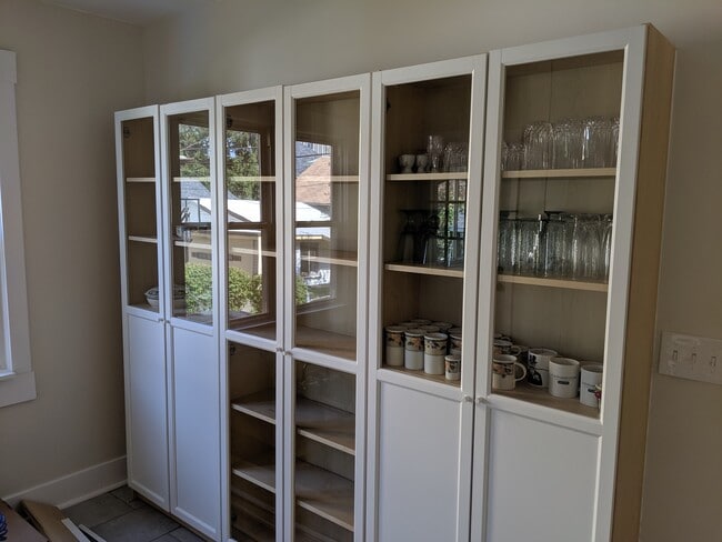 built in glass storage along a whole wall in kitchen - 1448 Lincoln Ave