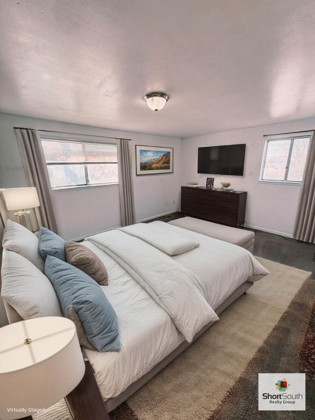 Building Photo - Updated - 2 bed 1.5 bath, Duplex with attached garage and fenced in backyard