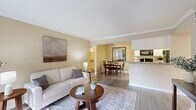 Located at 7100 Almeda in Houston, TX, this single-floor, 3-bedroom, 3-bathroom home offers a thoughtfully designed layout with a warm and inviting ambiance throughout. The open-concept living and dining area features crown molding, warm neutral tones, and wood-look flooring that flows seamlessly from the living space into the dining area. The kitchen is equipped with black appliances including a range, microwave, and refrigerator, complemented by granite countertops, white cabinetry, and a pass-through counter that connects to the dining space. Each of the three bedrooms is carpeted and bathed in natural light from large windows, with ceiling fans providing added comfort. The spacious primary bedroom includes a dedicated closet. The three bathrooms are finished with granite vanity countertops, tile-surround tub-shower combinations, and wood-look flooring, maintaining a clean and consistent aesthetic. Additional storage is provided by two closets, one of which houses the water heater. Crown molding accents the common areas, adding a refined touch to the overall design. The unit combines functional living spaces with cohesive finishes, making it a practical and comfortable home in the Houston Medical Center area.