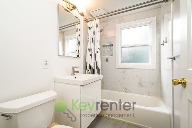 Building Photo - Remodeled Five Bedroom Retreat with Yard a...
