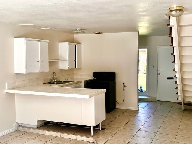 Kitchen view to front door Apt B - 619 W Provential Dr