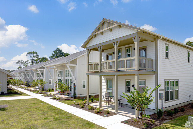 Sidewalk between buildings. - The Cottages at Myrtle Beach (new)