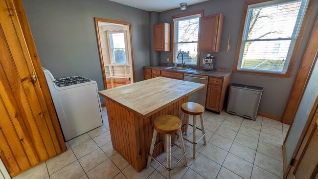 Kitchen with butcher block island, gas cooking and rare walk-in pantry offering excellent storage - 37 Glover Ave