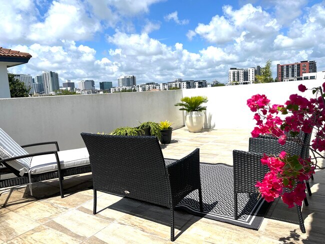 Enjoy the sunshine and breezy nights on your own private rooftop! Patio furniture included! - 812 NE 7th St
