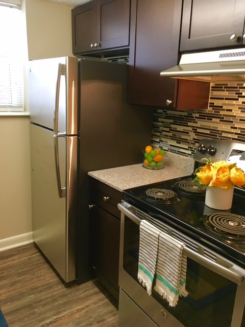 Our premier unit includes brand new stainless steel appliances - The Arts Apartments at West Napoleon