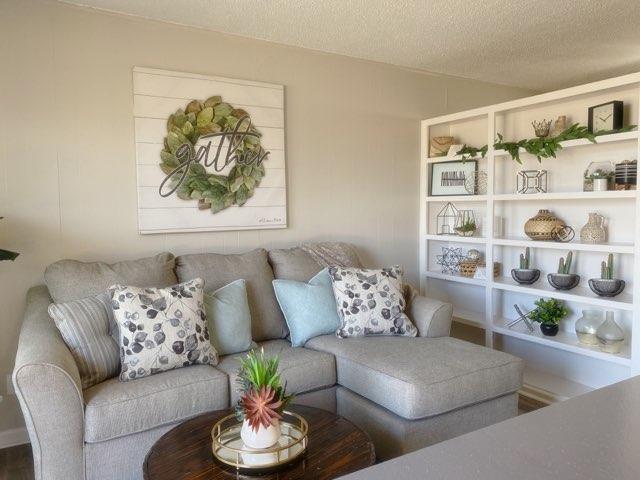 Renovated Living Room with Built in Shelves - Somerset Apartments