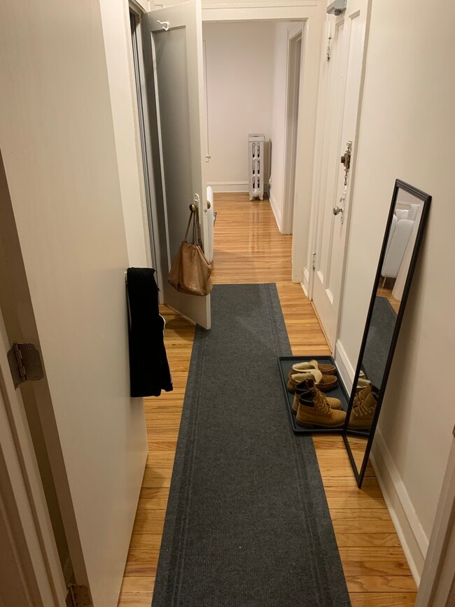 Hallway from bedroom to front door and living room - 729 Seward St