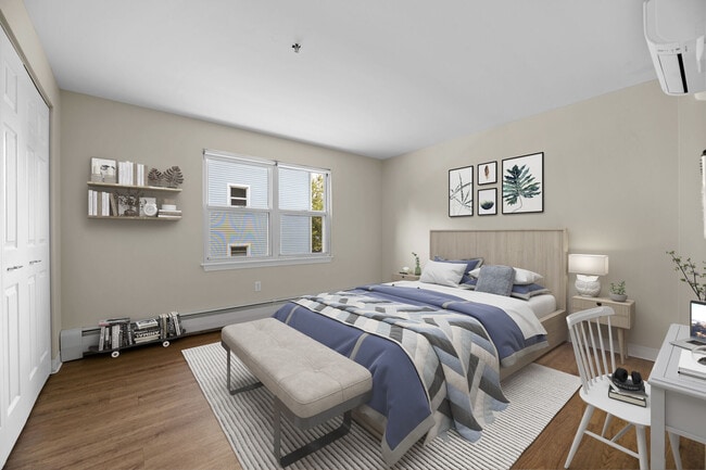 Comfortable bedrooms with natural light and generous space at Mission Main. - Mission Main