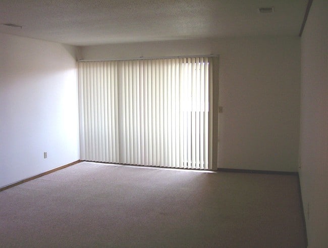 Our large living rooms open up to your own private porch or balcony. - Old Orchard By The Bay Apartments