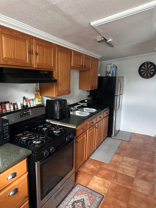 Full kitchen with full-size stove and refrigerator - 8333 Painter Ave