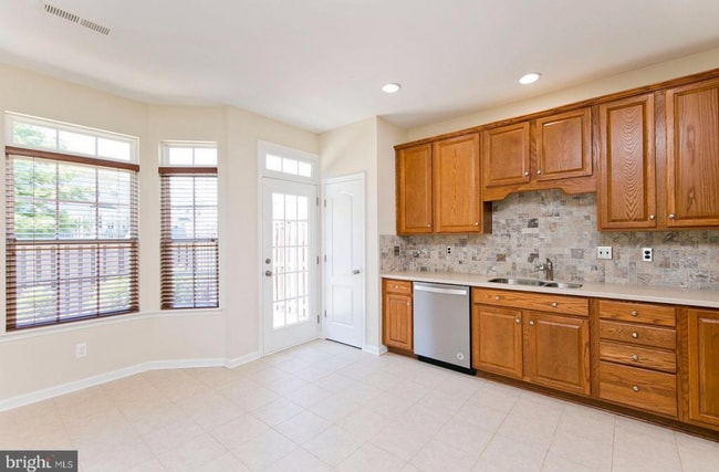 Kitchen and nook - 205 Kintyre Ln