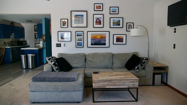Bright living room with vaulted cieling. - 384 Minz Park Cir